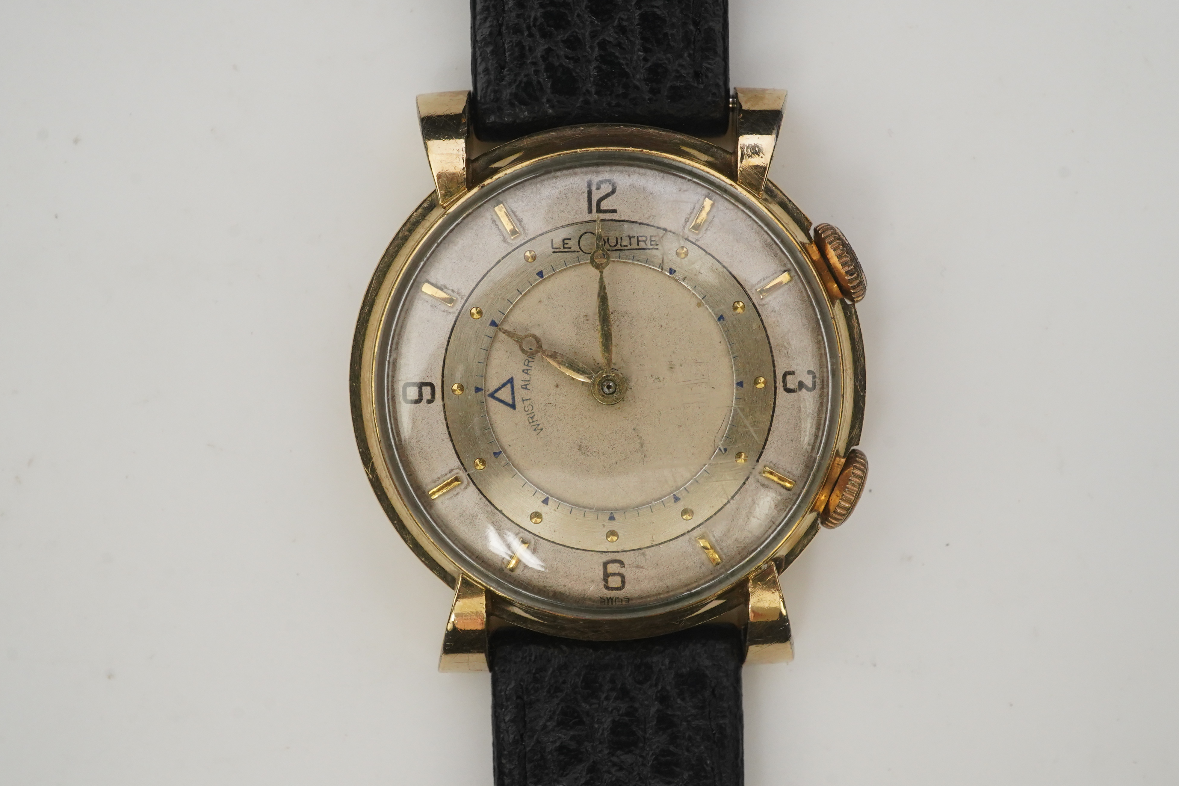 A gentleman's 1950's? 10k gold filled Jaeger LeCoultre Memovox manual wind wrist watch, on a later associated leather strap